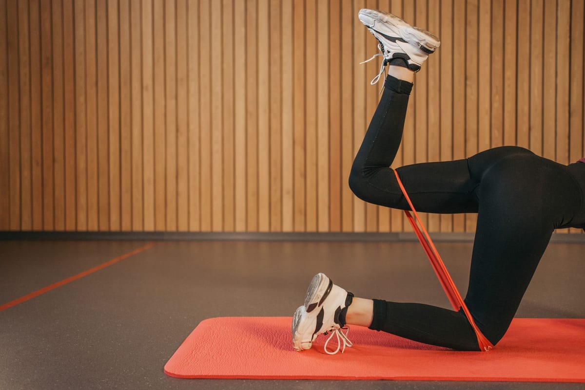 A resistance band exercise on a mat